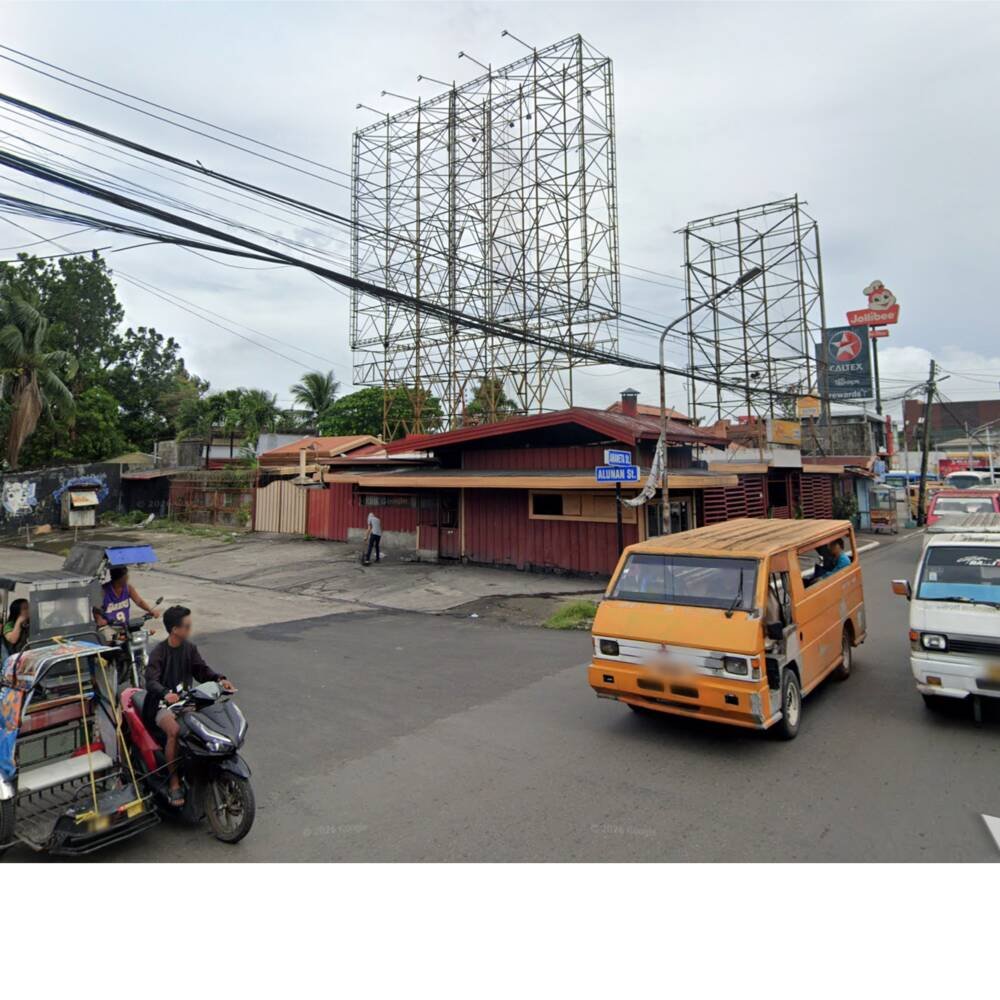 Corner building with billboard structures behind it