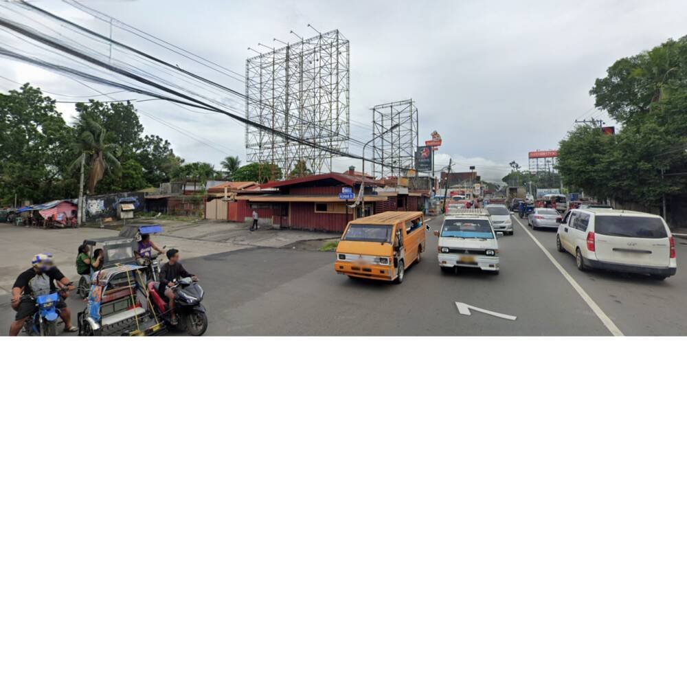 Traffic passing the corner, jeepneys and vans
